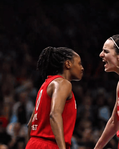 Two Female Basketball Players Wearing Red Uniforms With The Number 8 On The Back GIF