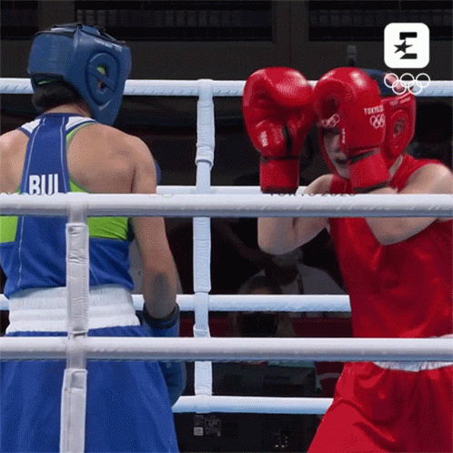 Two Female Boxers Fighting, One Wearing Bu