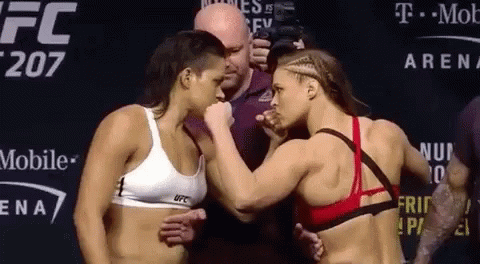 Two Female Fighters Next to T Mobile Sign