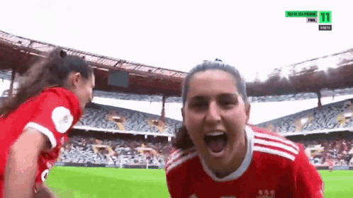 Two Female Soccer Players Celebrating Goal 71