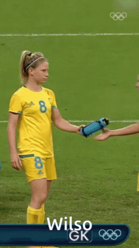 Two Female Soccer Players on Field with Wilso GK