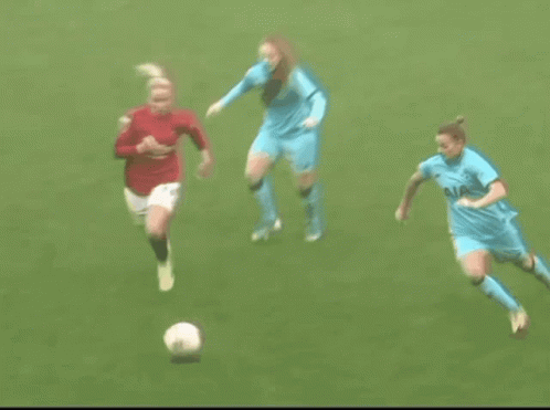 Two Female Soccer Players Playing
