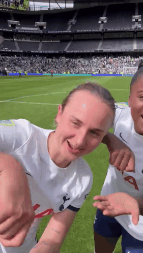 Two Female Soccer Players Pose
