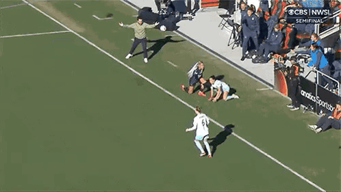 Two Female Soccer Players Talking on Field