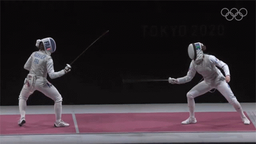 Two Fencers Are Fighting On A Mat With The Olympic Rings In The Background GIF