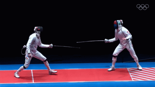 Two Fencers Are Fighting On A Red And Blue Mat With The Olympics Logo In The Background GIF