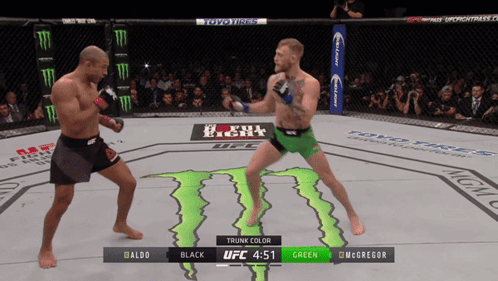 Two Fighters Fighting Monster on Floor