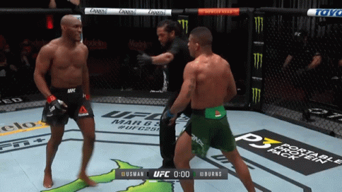 Two Fighters In A Ufc Ring With A Scoreboard That Says Burns At The Bottom GIF