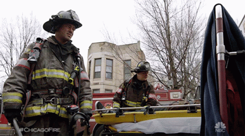 Two Firefighters Next To Stretcher Saying Chicagofire GIF