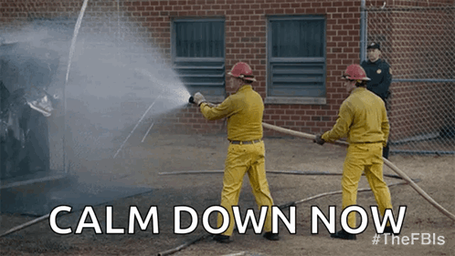 Two Firefighters Spraying Water On A Fire With The Words Calm Down Now Behind Them GIF