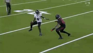 Two Football Players Are Playing A Game On A Field . One Of The Players Is Wearing A Number 8 Jersey . GIF