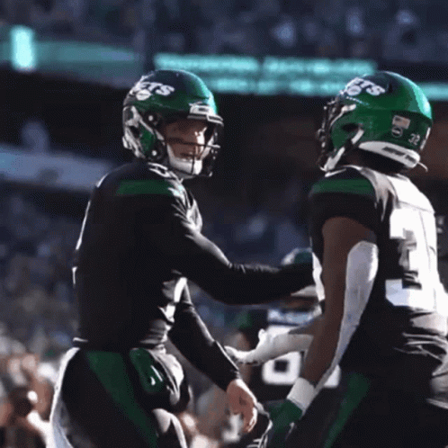 Two Football Players Carter and Wilson Hugging