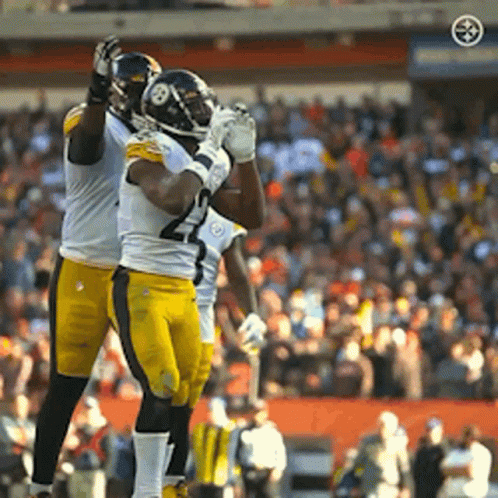 Two Football Players Celebrating Touchdown GIF