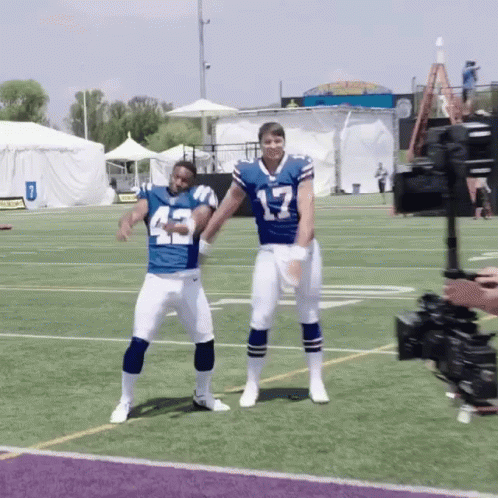 Two Football Players Dancing Number 17