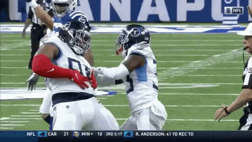 Two Football Players Fighting With Referee GIF