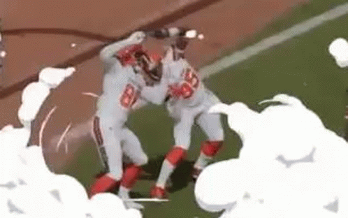 Two Football Players Fighting with Smoke