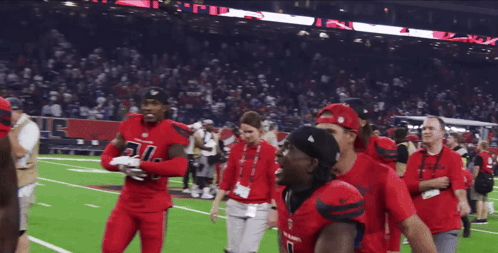 Two Football Players Hugging Number 2 Jersey