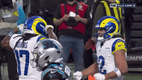 Two Football Players in Rams Uniforms