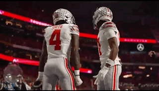Two Football Players Number 4