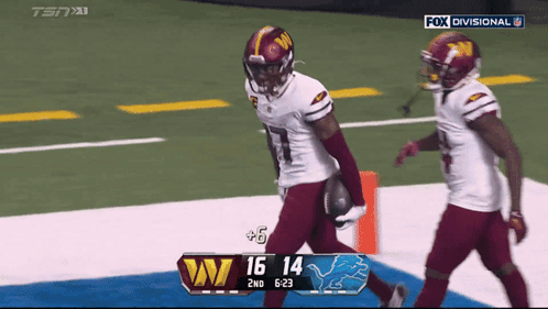 Two Football Players On A Field With Fox Divisional On The Bottom GIF