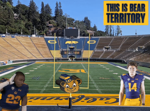 Two Football Players on Field Saying This Is Bear Territory