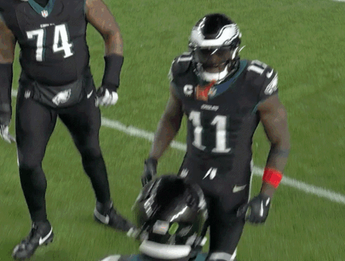 Two Football Players One Wearing Number 1