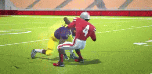 Two Football Players Playing Game on Field
