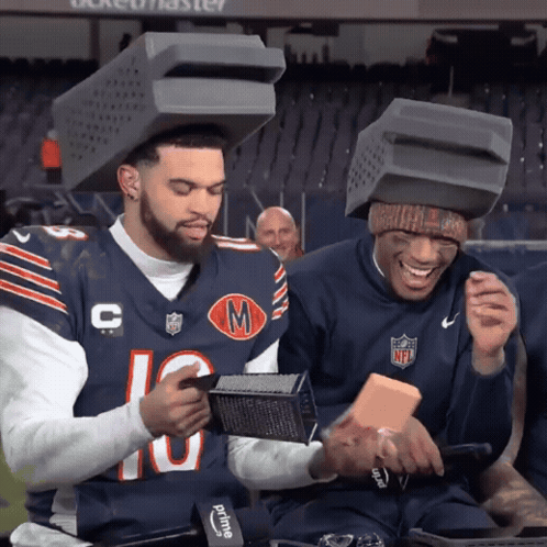Two Football Players With Boxes on Heads Number 10
