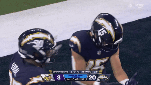 Two Football Players With Number 15 Helmets GIF