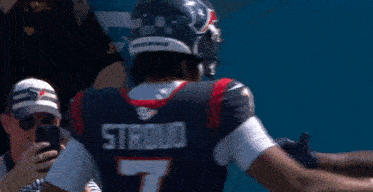 Two Football Players With Stroud On The Back Of Their Jersey Hugging Each Other GIF