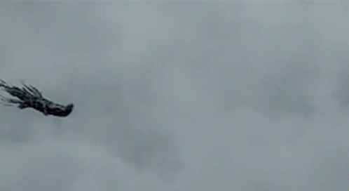 Two Ghosts Are Flying Through The Air In A Cloudy Sky GIF
