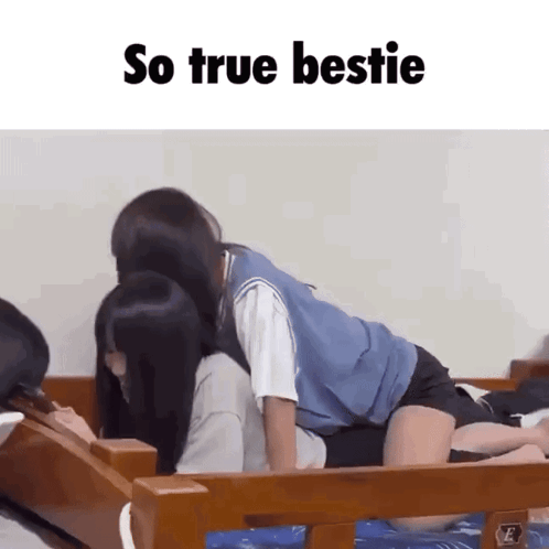 two girls are kissing on a bed with the words so true bestie above them