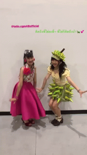 Two Girls Posing With Latin.cg48official Text GIF
