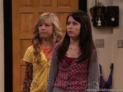 Two Girls Are Standing In Front Of A Door And The Website Ruinedchildhood.com Is Visible GIF