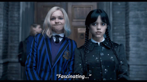 Two Girls Are Standing Next To Each Other And One Of Them Is Saying Fascinating GIF