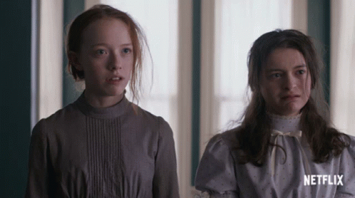 Two Girls Are Standing Next To Each Other With Netflix Written On The Bottom GIF