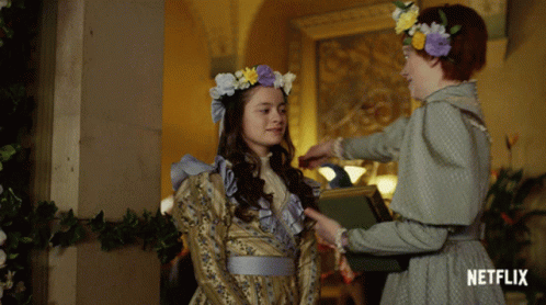Two Girls Are Standing Next To Each Other With Netflix Written On The Bottom Of The Image GIF