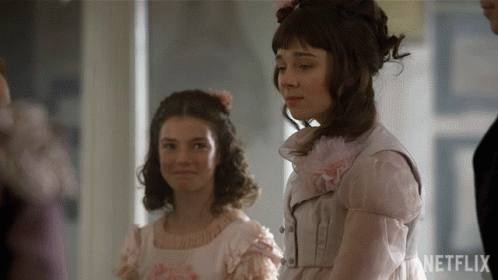 Two Girls Are Standing Next To Each Other With Netflix Written On The Bottom Right GIF