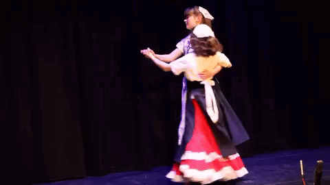 Two Girls Dancing in Costumes