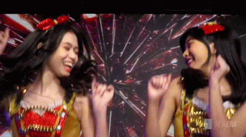 Two Girls Dancing in Front of Fireworks Cinema