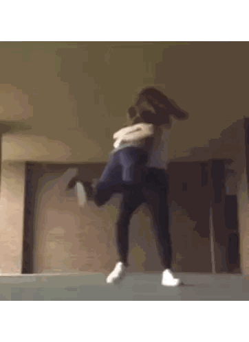 Two Girls Hugging in Front of Building
