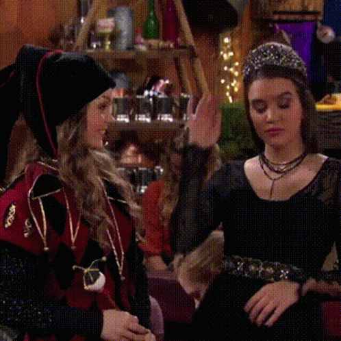 two girls in costumes are standing next to each other and the words all right are above them