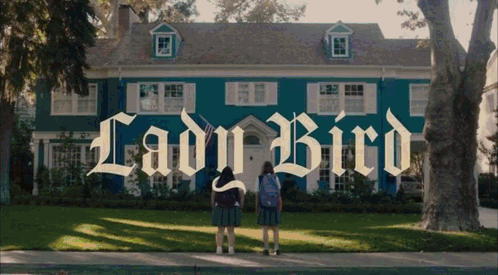 Two Girls in Front of Lady Bird House