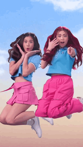 Two Girls Jumping One Pointing GIF