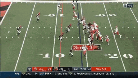 Two Girls Looking at Each Other Give the Ball to Nick Chubb