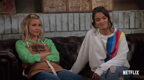 Two Girls on Couch With Netflix Written on Bottom