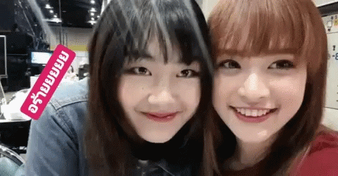 Two Girls Posing With Sticker Saying A