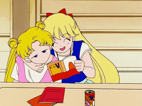 Two Girls Reading Book with Letter V