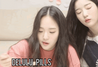 Two Girls Sitting Next To Each Other GIF