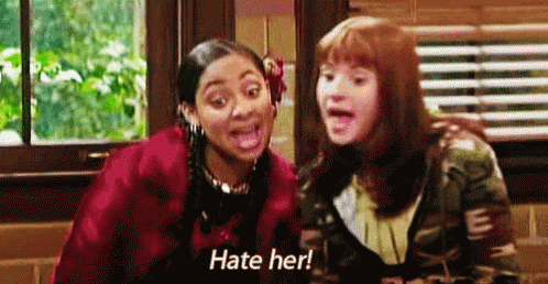 Two Girls Sitting Together Saying Hate Her GIF